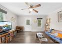 Living room with hardwood floors, ceiling fan and neutral-colored walls at 485 Lincoln St, Cramerton, NC 28032