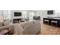 Inviting living room with modern furnishings, neutral tones, and an open layout leading to a dining area at 577 Nesbe St # 2222, Lancaster, SC 29720