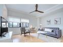 Bright living room with comfortable seating, hardwood floors and large windows at 715 N Church St, Charlotte, NC 28202