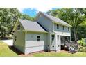 This home offers a spacious backyard with rear entry to the deck and crawl space, with gray vinyl siding at 8701 W Dixie Dr, Charlotte, NC 28278