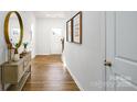 Inviting foyer featuring hardwood flooring, stylish console table, and decor leading to the main living spaces at 1044 Horizon Ln, Chester, SC 29706