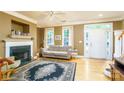 Comfortable living room with a fireplace, large windows, and hardwood floors, perfect for relaxation at 123 Singleton Rd, Mooresville, NC 28117