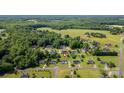 Neighborhood aerial view with a pinpoint on the home's location amidst lush trees and greenery at 170 Wagon Wheel Way # 4, Salisbury, NC 28147