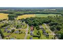 Aerial view of the property with surroundings, including nearby fields and mature trees at 170 Wagon Wheel Way # 4, Salisbury, NC 28147