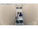 Convenient mudroom area with storage bench and nautical themed decor at 180 Asmodean Ln, Troutman, NC 28166
