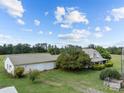 Expansive property featuring a charming home and large detached garage, ideal for various needs at 18070 Old Beatty Ford Rd, Gold Hill, NC 28071