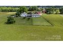Charming farmhouse and barn with fenced pasture on beautiful land, ready for your animals at 18070 Old Beatty Ford Rd, Gold Hill, NC 28071
