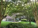 Charming home with wood siding, manicured lawn, and mature trees offering great shade at 2045 10Th Street Nw Ln, Hickory, NC 28601
