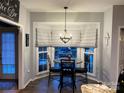 Cozy breakfast nook with a chandelier and large windows offering natural light and views of the outdoors at 208 Stone Ridge Dr, Salisbury, NC 28146