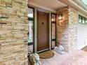 Elegant front entrance with stone facade, decorative lion statues, and a stylish front door at 218 Point Carpenter Rd, Fort Mill, SC 29707