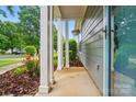Charming front porch with inviting entryway and manicured landscaping at 317 Cedarcroft Dr, Mooresville, NC 28115