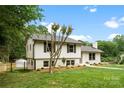Two-story home with fresh landscaping, featuring a well-manicured lawn at 3661 Annlin Ave, Charlotte, NC 28209