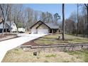 Well-manicured front yard and long driveway leading to a charming single-story brick home at 4531 Dry Run Rd, Fort Mill, SC 29708
