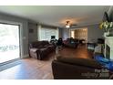 Bright living room featuring a fireplace, hardwood floors and neutral paint colors at 616 E Oakwood Ave, Albemarle, NC 28001