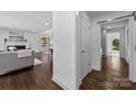 Hallway showcases beautiful hardwood floors and access to multiple rooms in the home at 917 Dent Ct, Charlotte, NC 28210