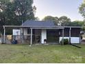 View of the home's backyard featuring a covered patio at 1014 Skyway Dr, Kannapolis, NC 28083