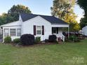 Charming single-story home featuring a landscaped front yard and accessible ramp at 1014 Skyway Dr, Kannapolis, NC 28083