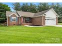 Charming brick home with a two-car garage and well-maintained lawn at 112 Chasse Ct, Cleveland, NC 27013