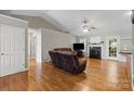 Spacious living room featuring hardwood floors, a fireplace, and ample seating at 112 Chasse Ct, Cleveland, NC 27013