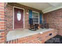 Cozy front porch with rocking chairs, perfect for relaxing outdoors at 112 Chasse Ct, Cleveland, NC 27013
