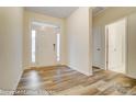 Inviting entryway with natural light, laminate floors, and white trim, a welcoming first impression at 125 S Prestwick Way # 41, Mooresville, NC 28115
