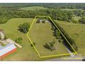 Expansive property aerial showcasing the well-maintained land, mature trees, and home at 130 Johnson Dairy Rd, Rockwell, NC 28138