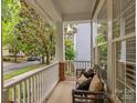 Welcoming front porch with bench seating, perfect for relaxing outdoors at 15913 Trenton Place Rd, Huntersville, NC 28078