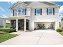 Two-story home featuring a two-car garage and inviting front porch with stone accents at 1600 Gaston Mountain Dr, Dallas, NC 28034