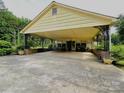 Large, covered carport with ample parking and a connection to the house at 1922 Salem Church Rd, Lincolnton, NC 28092