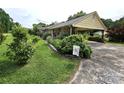 Exterior view featuring a covered carport and lush landscaping at 1922 Salem Church Rd, Lincolnton, NC 28092