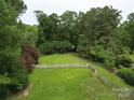Sprawling backyard with a white picket fence and plenty of space for outdoor activities at 206 Rose Ter, Wadesboro, NC 28170
