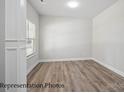 Spacious bedroom with hardwood floors, a large window, and neutral paint at 215 Lake George Dr, Shelby, NC 28152
