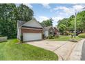 Charming single-story brick home with a well-maintained lawn and a long driveway at 2333 Wednesbury Ct, Kannapolis, NC 28083