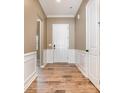 Elegant entryway with hardwood floors, white wainscoting, and neutral paint at 3105 Bonterra Blvd, Indian Trail, NC 28079