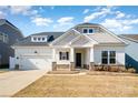 Attractive single-Gathering home features a well-maintained lawn, stone accents, and a two-car garage at 3105 Bonterra Blvd, Indian Trail, NC 28079