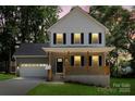 Charming two-story home featuring a welcoming front porch and well-manicured lawn at 4541 Kings Ct, Hickory, NC 28602
