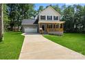 Beautiful two-story house with a front porch, garage, and well-maintained lawn at 4541 Kings Ct, Hickory, NC 28602