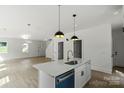 Open concept kitchen with an island and stainless steel appliances at 4541 Kings Ct, Hickory, NC 28602
