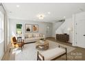 Bright living room featuring neutral décor, a stylish rug, and ample natural light at 4541 Kings Ct, Hickory, NC 28602