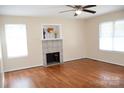 Inviting living room with hardwood floors, neutral walls, fireplace and natural light at 517 N Pine Ln, Wadesboro, NC 28170