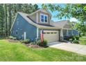 Beautiful home with a well-kept lawn, featuring a two-car garage and inviting curb appeal at 528 Sandbar Pt, Clover, SC 29710