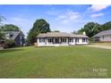 Charming single-story home with a well-kept lawn and inviting curb appeal at 554 Isle Of Pines Rd, Mooresville, NC 28117