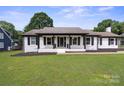 Beautiful single-story home with a manicured lawn and welcoming entrance at 554 Isle Of Pines Rd, Mooresville, NC 28117