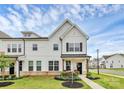 Beautiful two-story townhome with manicured lawn, and inviting front porch at 720 Herlong S Ave, Rock Hill, SC 29732