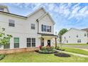 Beautiful two-story townhome with manicured lawn, and inviting front porch at 720 Herlong S Ave, Rock Hill, SC 29732