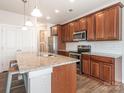 Modern kitchen boasts granite countertops, stainless steel appliances, ample cabinet space, and a convenient island at 805 Old Little Rock Rd, Charlotte, NC 28214