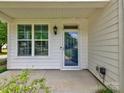 Inviting front porch features classic design elements, ample natural light, and pleasant views at 13421 Copley Square Dr, Huntersville, NC 28078