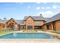 A backyard pool features an attached outdoor living area at 1822 Irby Rd, Monroe, NC 28112