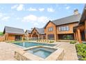 A large pool and spa sit beside a covered area at 1822 Irby Rd, Monroe, NC 28112