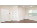 Bright living area features wainscoting, wood floors, and lots of natural light at 1914 Loggerhead Dr, Lancaster, SC 29720